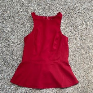 Peplum sleeveless shirt